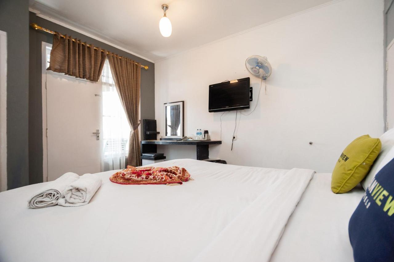 Urbanview Hotel Ananda Syariah By Reddoorz Букиттинги Экстерьер фото